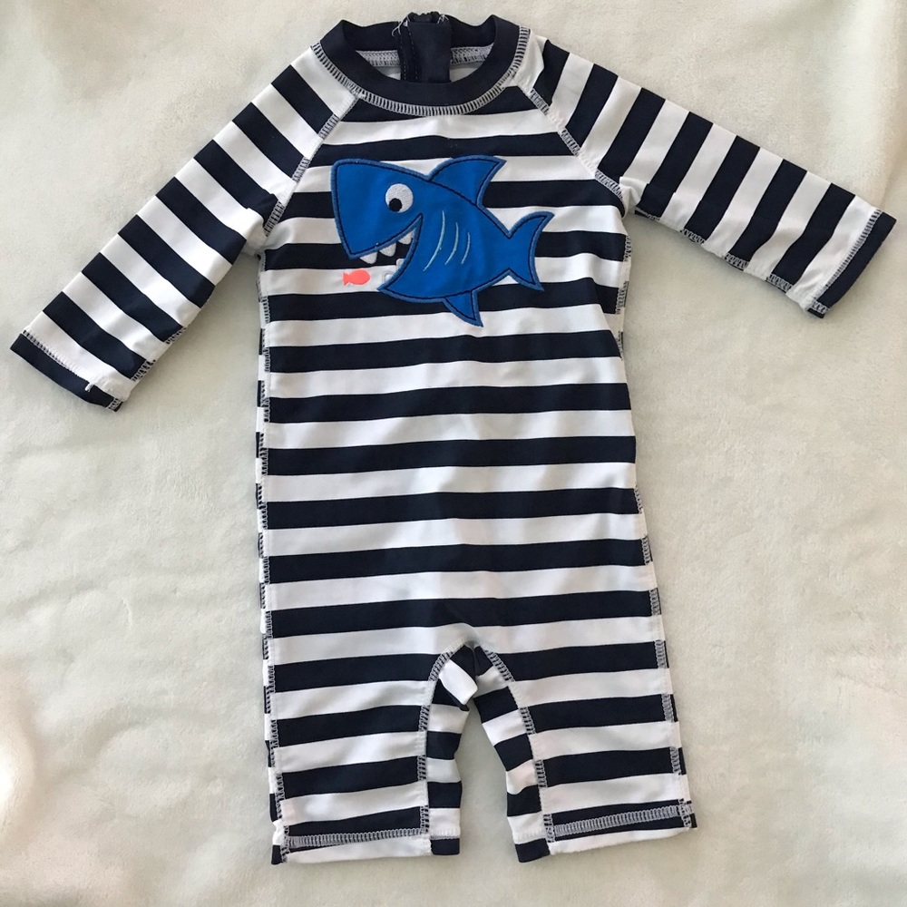 Blue and white striped shark rash guard